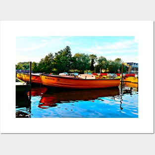 Vibrant orange boats at Windsor riverside uk Posters and Art